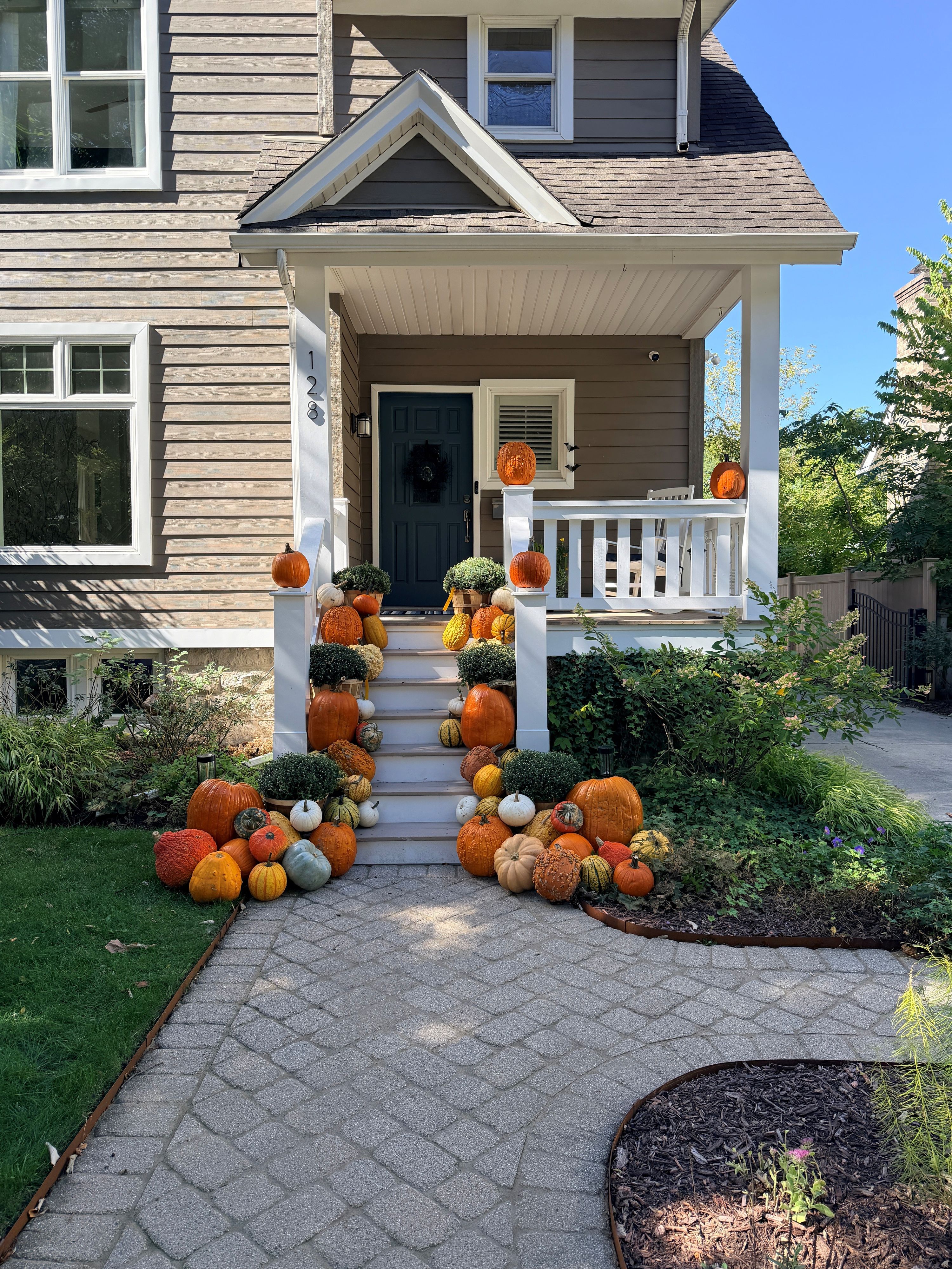 Fall pumpkin display installed by our crew on a Chicago-area front porch